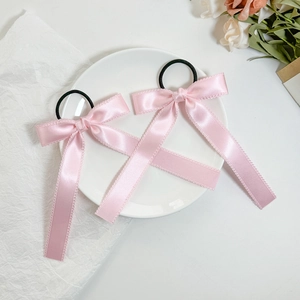 Set of two pink satin bow hair ties with delicate scalloped edges and high elastic bands