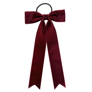 Elegant vintage burgundy velvet bow hair scrunchie with long streamers on white background