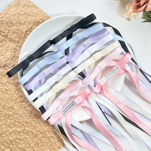 Five ballet style ribbon bow hair clips in black, blue, purple, white and pink colors