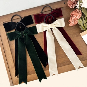 Elegant vintage velvet bow hair ties with long ribbons in black, burgundy, and green