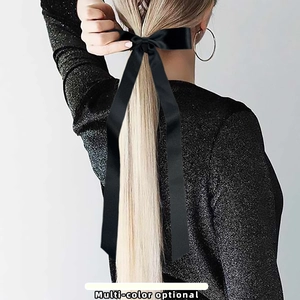 Elegant long black satin bow hair tie for women stylish ponytail accessory on model