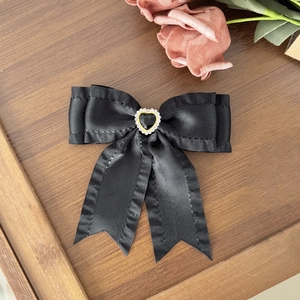 Elegant vintage black satin ribbon bow hair clip with rhinestone heart gemstone detail