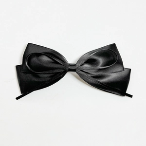 Elegant black satin double-layered bow hair clip with a minimalist polished finish