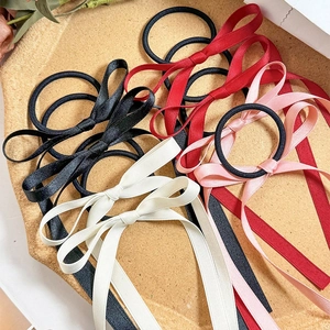Elegant set of four silk ribbon bow hair ties in black, burgundy, pink and ivory tones