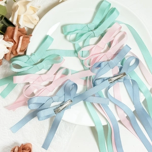 Elegant ribbon bow hair clips in pastel colors with long streamers for women hairstyles