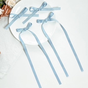 Set of four light blue grosgrain ribbon bow hair clips with long tails for girls