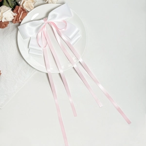 Elegant white satin and pink ribbon bow hair clip with long streamers for women