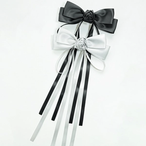 Elegant satin bow hair clips with silk roses and long ribbons in black and white