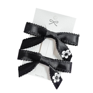 Elegant 2-piece set of black satin bow hair clips with white floral embroidery and lace trim