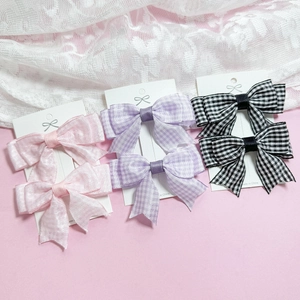 Tres pares de pinzas para el pelo con lazos de cuadros en rosa, púrpura y negro