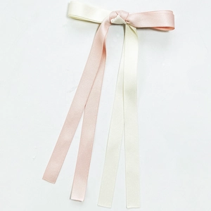 Elegant two-tone pink and cream satin ribbon bow hair clip with long streamers for women