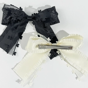 Sweet double-layered bow hair clips in black and beige with heart patterns