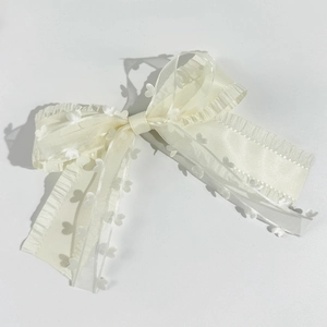 Sweet white layered double bow hair clip with ruffle edges and small 3D heart details