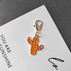 Cute orange cactus keychain with gold lobster clasp and sweet cactus charm on card