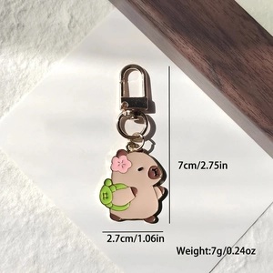 Porte-clés Capybara mignon en alliage avec fleur de cerisier et sac à dos vert