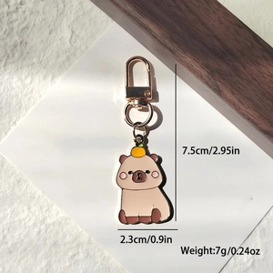 Mignon porte-clés Capybara en émail avec orange sur la tête et fermoir en alliage doré