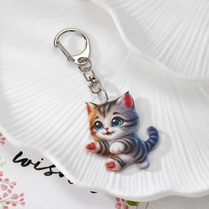 Cute acrylic cartoon cat keychain with colorful double-sided print on a white shell tray