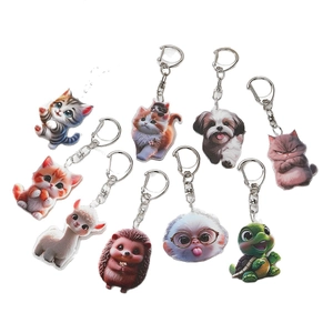 Set of 9 colorful acrylic animal keychains featuring cute cats and dogs on white background