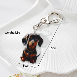 Detail shot showing 8.5cm height and 3cm width of acrylic dachshund keychain charm