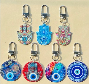 Set di sette portachiavi in acrilico con mano di Fatima, malocchio e motivi mandala