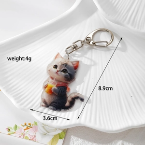 Detail view of cat acrylic keychain measuring 8.9cm by 3.6cm with 4g lightweight design