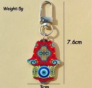 Portachiavi Mano di Fatima in acrilico con occhio, misura 7,6x3cm, peso 5 grammi