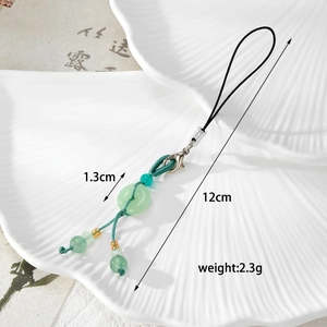 Detail of jade-style phone charm with 1.3cm smooth green beads and woven cord