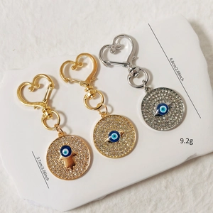 Set portachiavi Mano di Fatima e Malocchio con strass scintillanti e chiusura a cuore