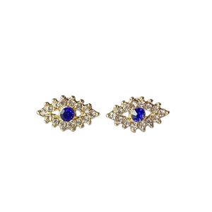 Boucles d'oreilles Œil de Turquie dorées avec strass brillants et pierre centrale bleue