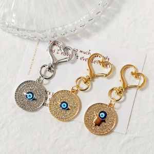 Ciondoli portachiavi Malocchio scintillanti in oro e argento con chiusure a cuore