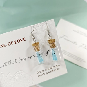 Boucles d'oreilles fantôme lumineux en mini bouteille de verre avec bouchons en liège