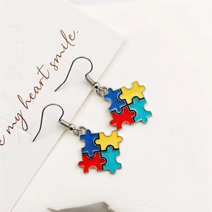 Colorful autism awareness puzzle drop earrings in vibrant enamel and silver metal