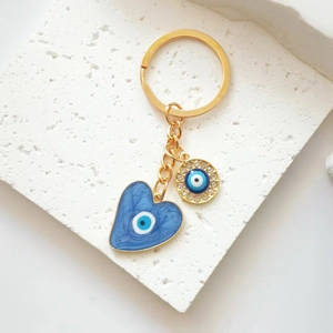 Goldener Herz Schlüsselanhänger mit blauem Evil Eye Anhänger und Strasssteinen