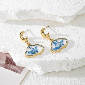 Cloud resin earrings with blue dried flowers and golden crescent moon studs