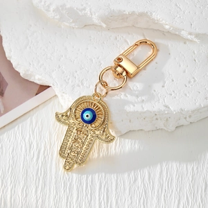Vintage Hamsa-Hand und Böses Auge Schlüsselanhänger mit Goldlegierung und Schnitzereien