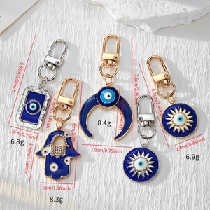 Detailed dimensions of Evil Eye keychain set with blue enamel and crystal moon sun charms
