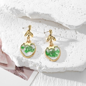 Handmade gold leaf earrings with heart-shaped resin pendants and green dried flowers