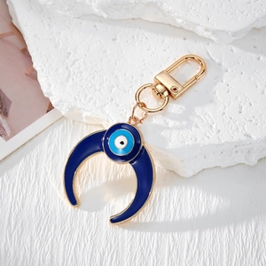 Retro moon and sun evil eye keychain with blue enamel and golden alloy plating