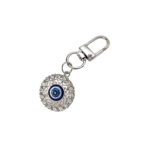 Silver metal evil eye keychain with blue resin center and white crystal border