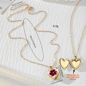 Gold heart locket necklace with red dried flowers and 49cm adjustable chain