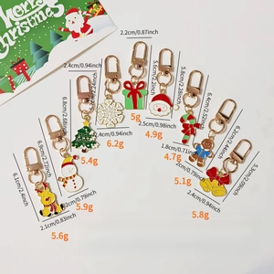 Dettaglio di 10 ciondoli natalizi in lega con misure e pesi per decorazioni borsa