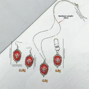 Gothic spider jewelry set detail showing necklace and earring dimensions and red oval inlay
