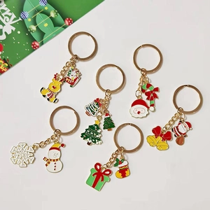 Close-up of 6-piece Christmas keychain set featuring colorful alloy pendants and charms