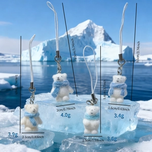 Detailed size chart for four mini polar bear plush charms with blue knitted scarves