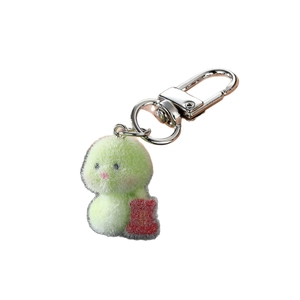 Cute green flocked chick keychain with silver lobster clasp on a clean white background