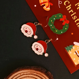 Detail of Christmas Santa and wreath earrings with colorful alloy oil drip finish