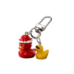 Cute resin little yellow duck keychain with red Christmas hat and sunglasses style