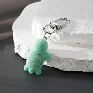 Detailed view of the cute flocked green turtle keychain with a silver metal lobster clasp