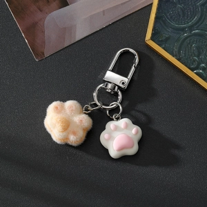 Portachiavi zampa di gatto in velluto e silicone con pelliccia arancione e cuscinetti rosa