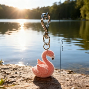 Pink flocked flamingo keychain with silver heart clasp and soft textured finish
